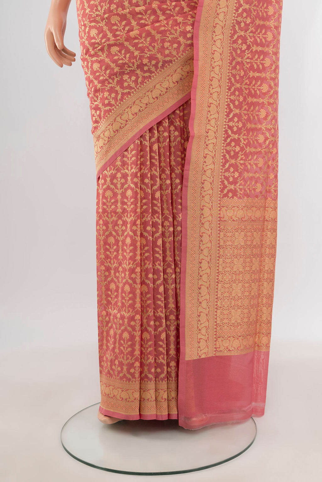 Pleats and pallu of Peach Banarasi Silk Saree with Zari And Thread Butta on the body and Zari Border. 