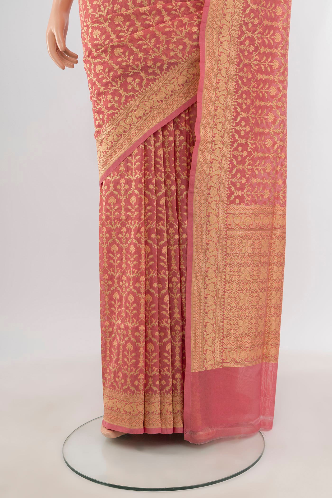 Pleats and pallu of Peach Banarasi Silk Saree with Zari And Thread Butta on the body and Zari Border. 