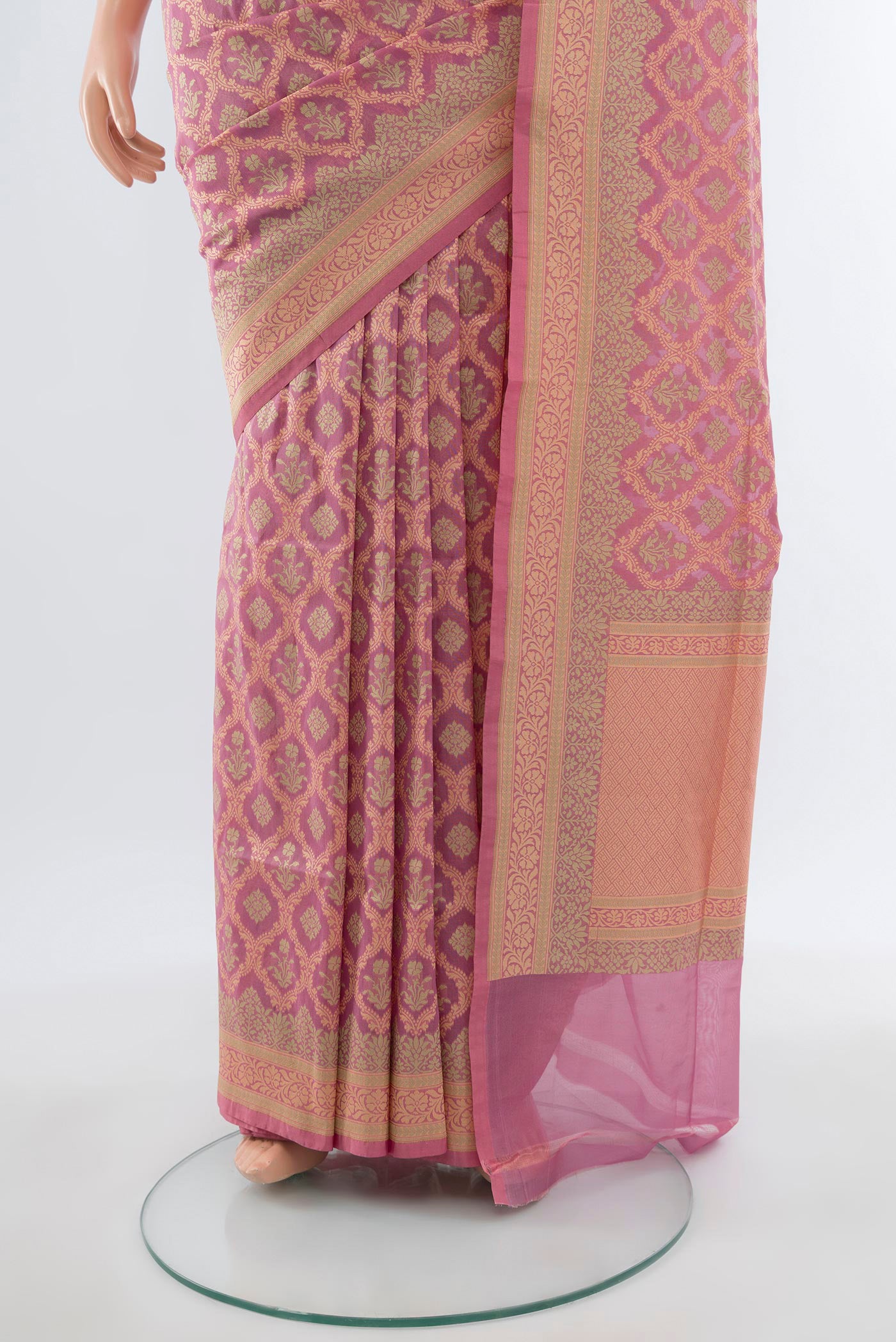 Pleats and pallu of Rose pink Banarasi Silk Saree with Zari Butta on the body and Zari Border. 