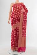 Peach Banarasi Silk Saree with Zari Butta on the body and Silk Border.  displayed on a mannequin