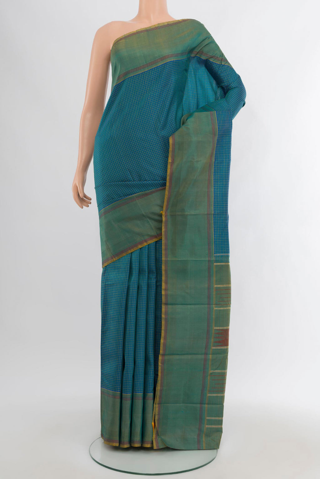 Peacock Blue Kanchipuram Silk Saree with Checked design on the body and Plain Border.  displayed on a mannequin