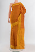 Mustard Kanchipuram Silk Saree with Stripes on the body and Zari Border.  displayed on a mannequin