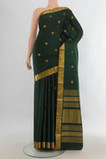 Pure Silk Pure Zari Sea Green Kanjivaram Saree with Zari Butta on the body and Silk Border.  displayed on a mannequin
