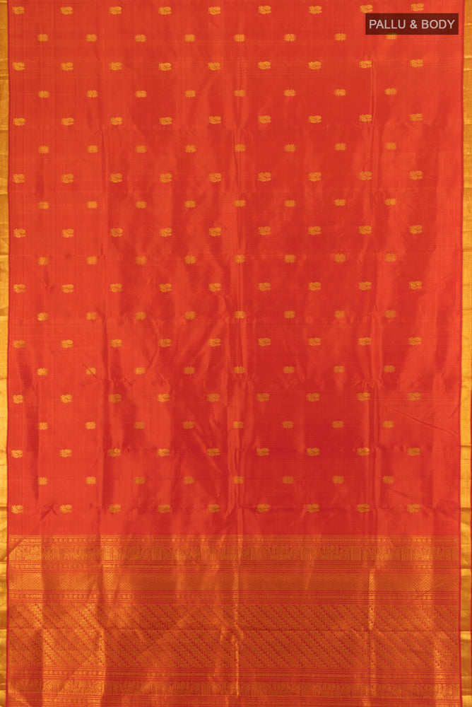 Flat view of Brick Orange Kanjivaram Silk Saree with Zari Butta on the body and Silk Border. 