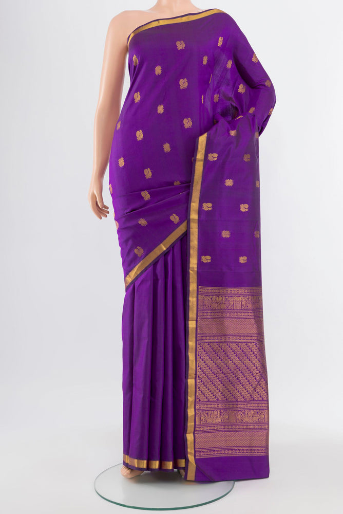 Violet Kanjivaram Silk Saree with Zari Butta on the body and Silk Border.  displayed on a mannequin