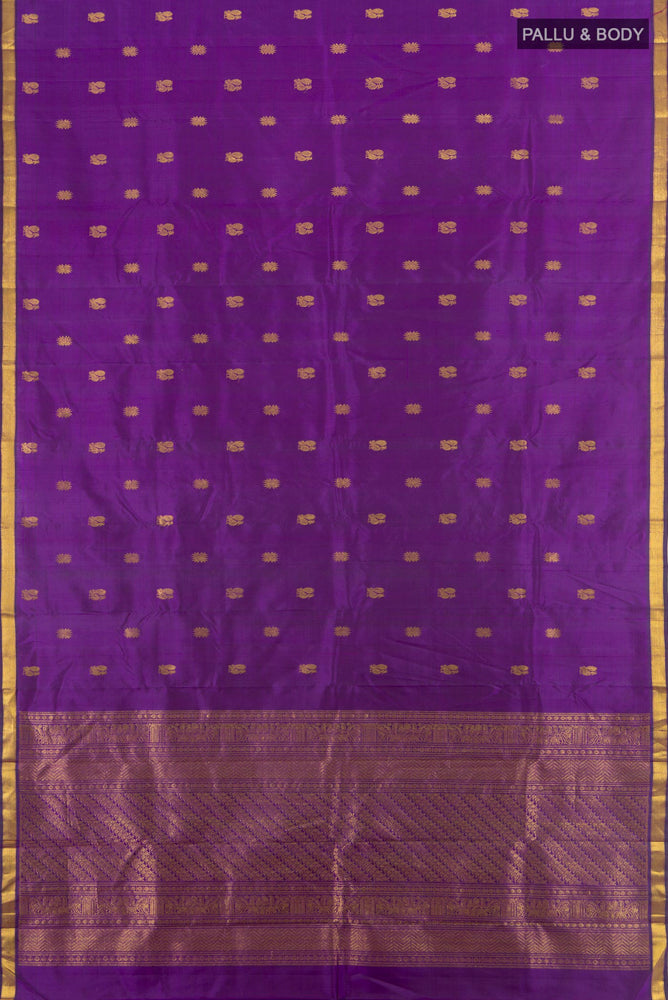 Flat view of Violet Kanjivaram Silk Saree with Zari Butta on the body and Silk Border. 