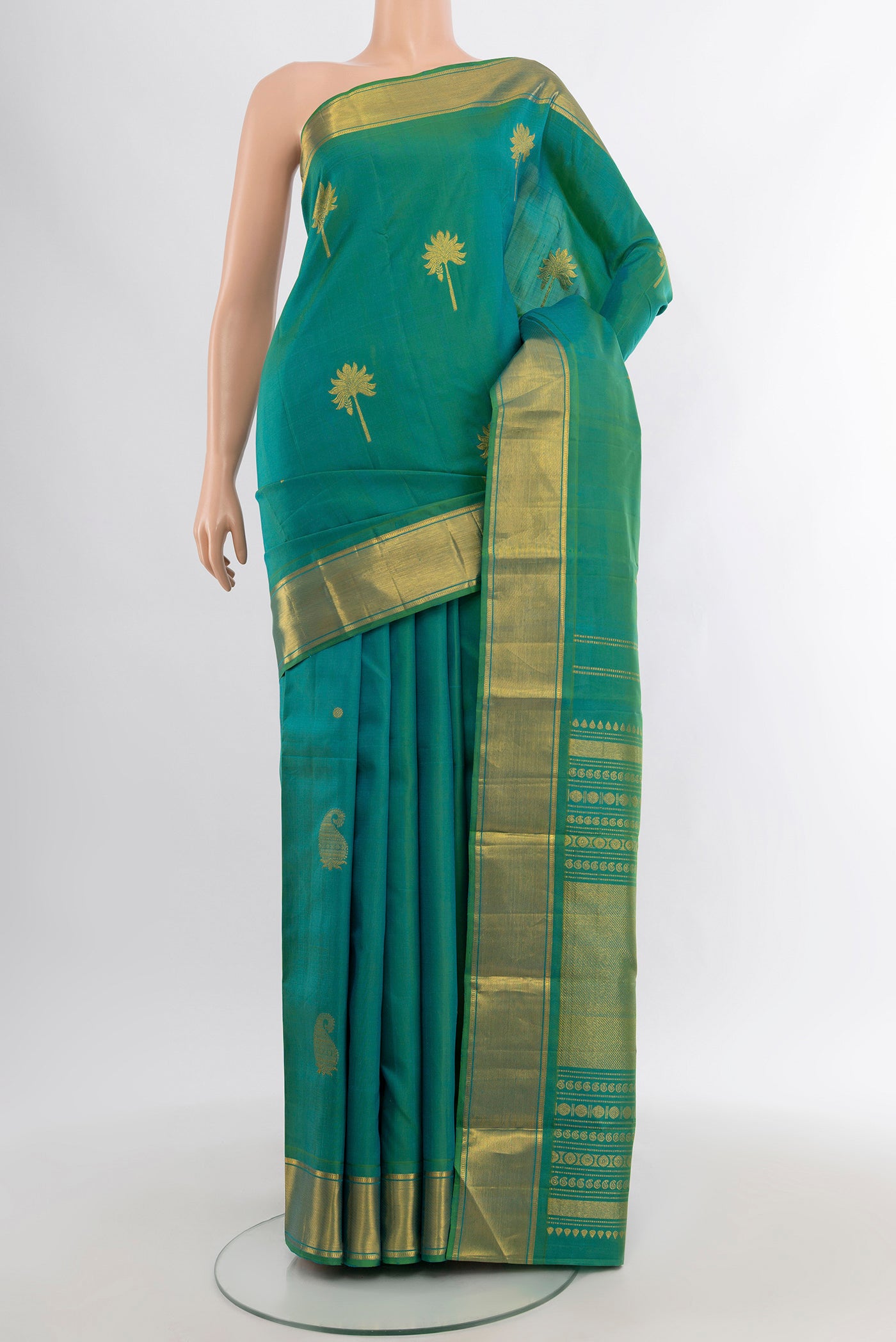 Blue with Green Color Kanjivaram Silk Saree with Zari Butta on the body and Zari Border.  displayed on a mannequin