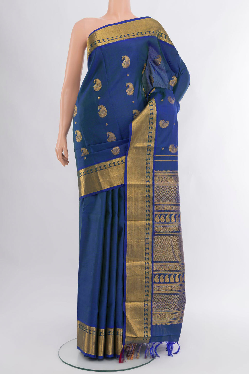 Peacock Blue Kanjivaram Silk Saree with Zari Butta on the body and Zari Border.  displayed on a mannequin
