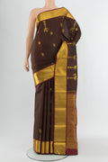 Multi Color Kanjivaram Silk Saree with Zari Butta on the body and Zari Border.  displayed on a mannequin