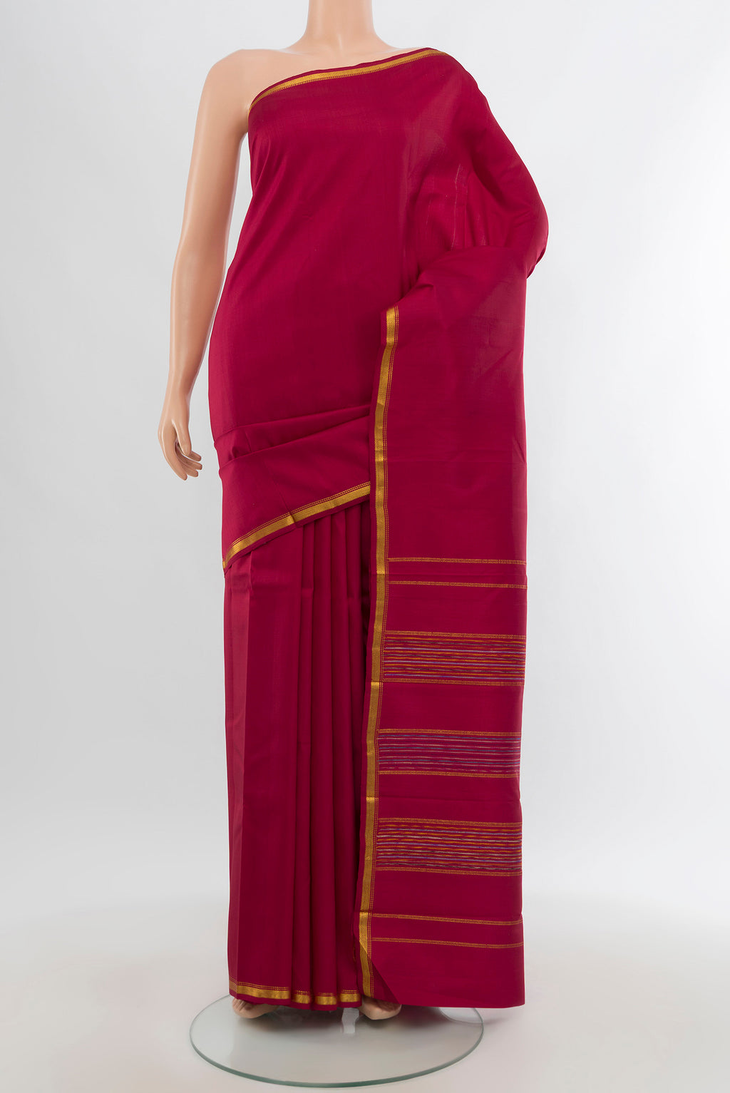 Maroon Kanchipuram Silk Saree with Plain Body and Zari Border.  displayed on a mannequin