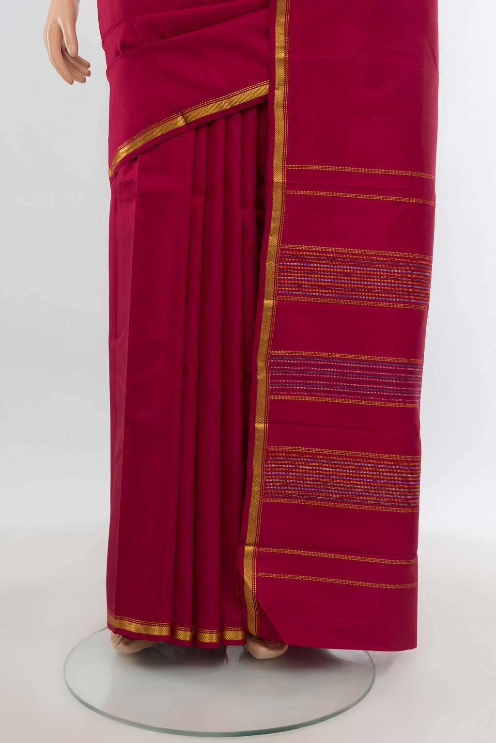 Pleats and pallu of Maroon Kanchipuram Silk Saree with Plain Body and Zari Border. 