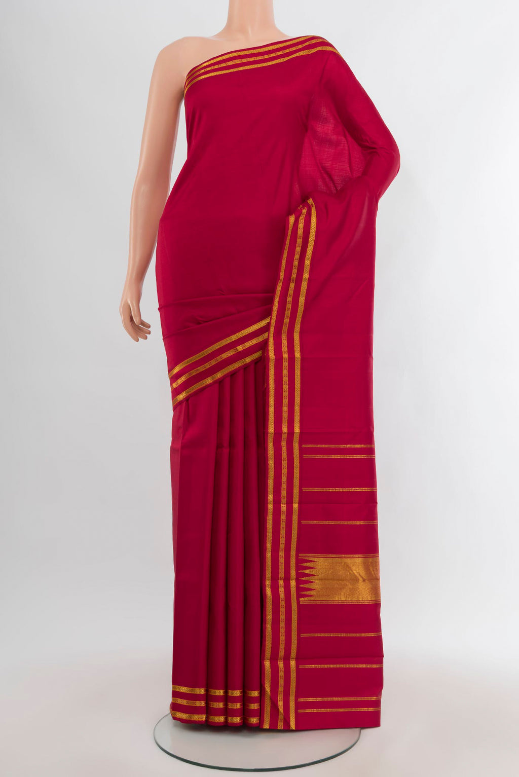 Maroon Kanchipuram Silk Saree with Plain Body and Zari Border.  displayed on a mannequin
