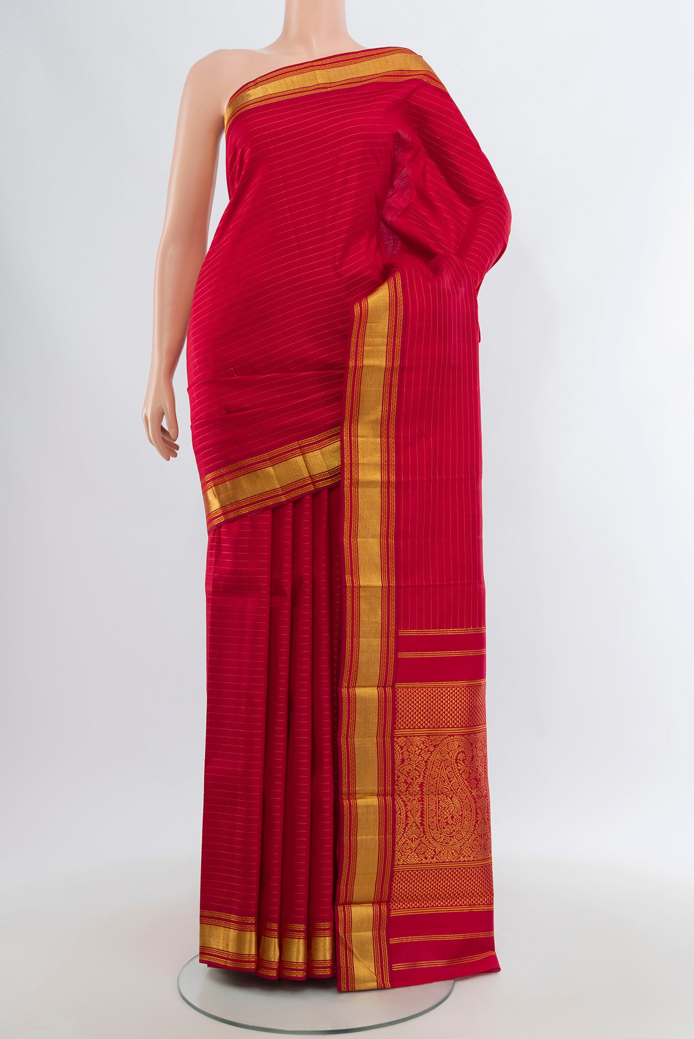 Deep Red Kanjivaram Silk Saree with Stripes on the body and Zari Border.  displayed on a mannequin