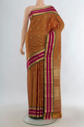 Pure Silk Mustard Kanjivaram Saree with Zari Butta on the body and Zari Border.  displayed on a mannequin