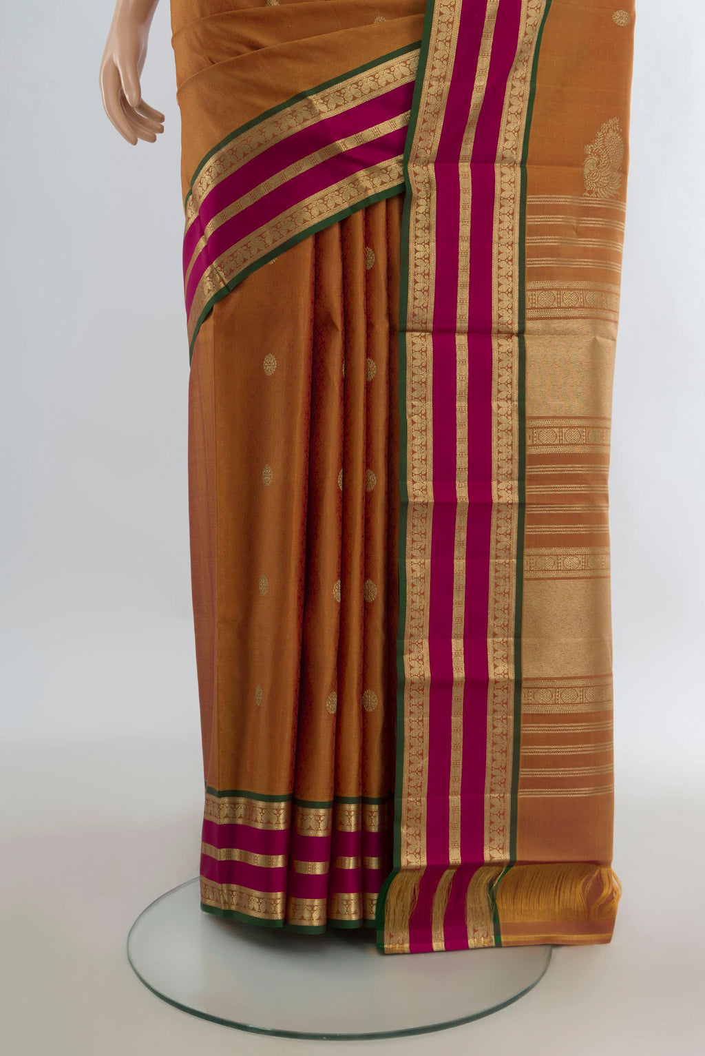 Pleats and pallu of Pure Silk Mustard Kanjivaram Saree with Zari Butta on the body and Zari Border. 
