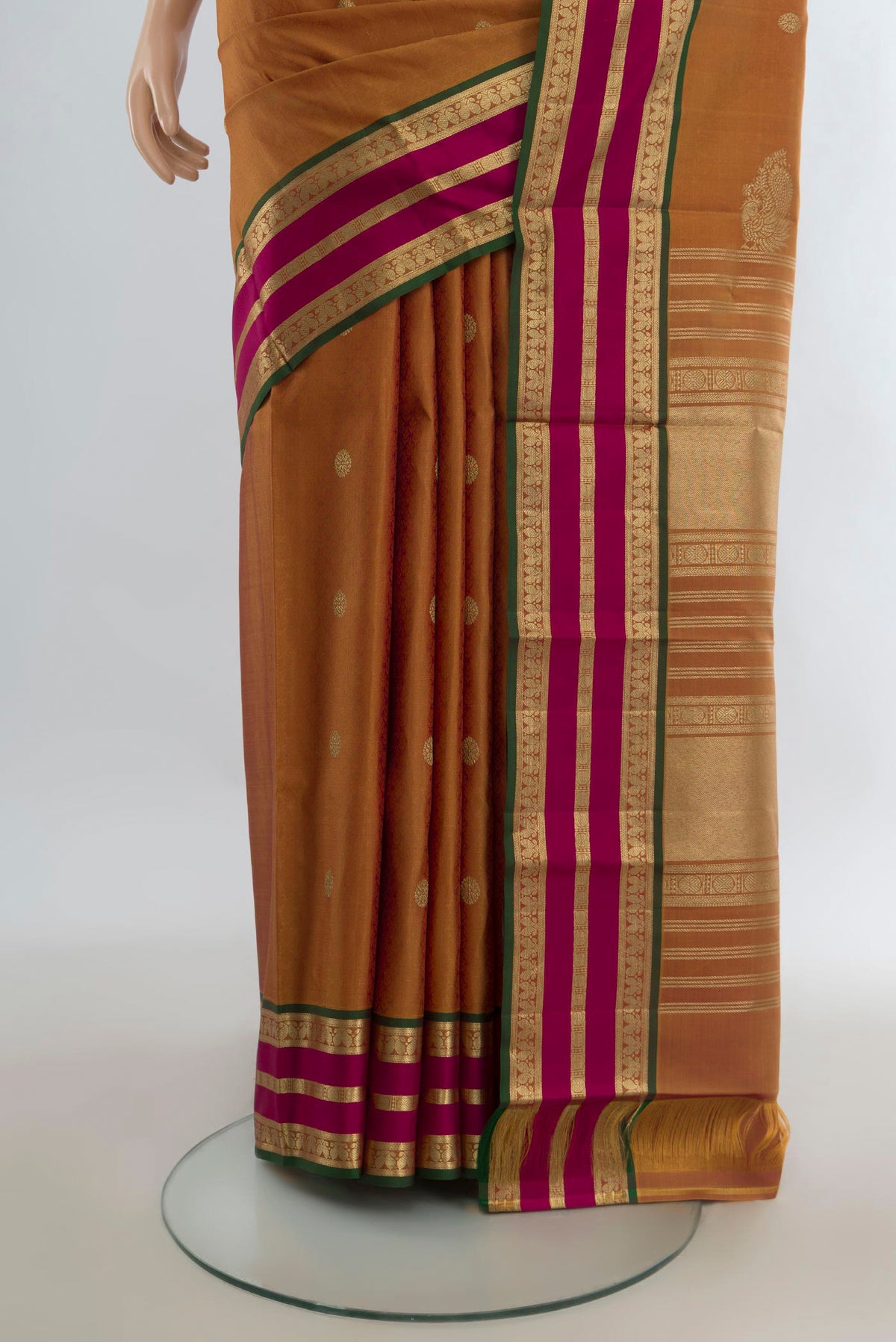 Pleats and pallu of Pure Silk Mustard Kanjivaram Saree with Zari Butta on the body and Zari Border. 