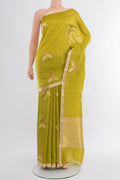 Green Banarasi Katan Silk Saree with Zari Butta on the body and Zari Border.  displayed on a mannequin