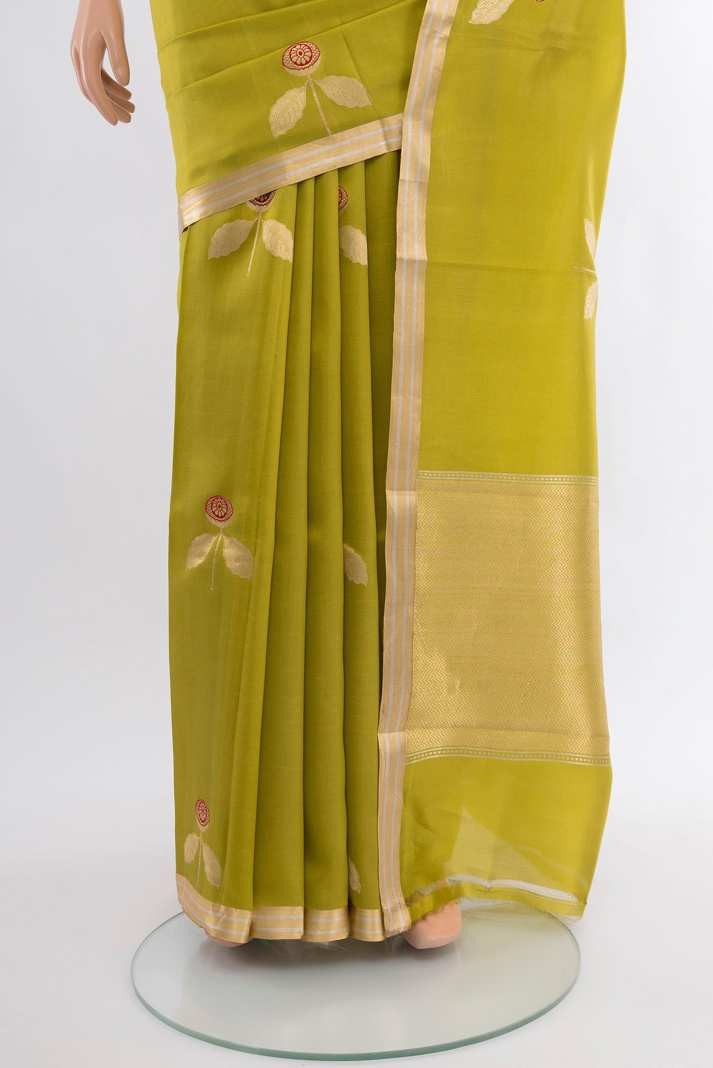 Pleats and pallu of Green Banarasi Katan Silk Saree with Zari Butta on the body and Zari Border. 