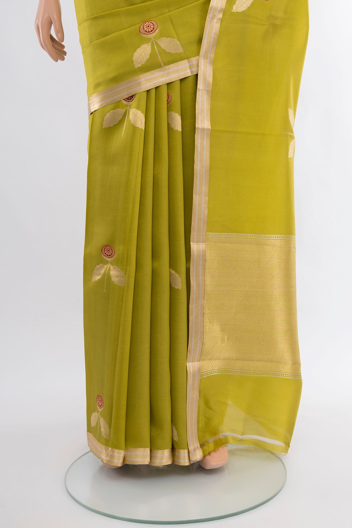 Pleats and pallu of Green Banarasi Katan Silk Saree with Zari Butta on the body and Zari Border. 