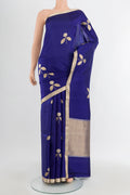 Navy Blue Banarasi Katan Silk Saree with Zari Butta on the body and Silk Border.  displayed on a mannequin