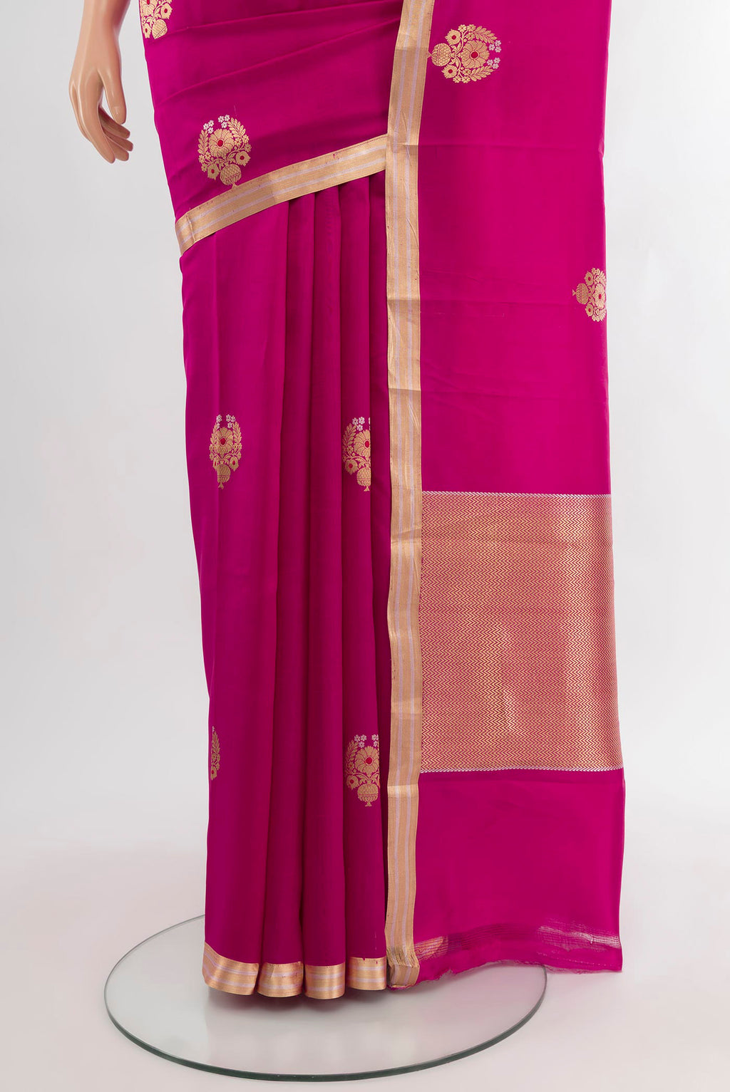 Pleats and pallu of Dark Pink Banarasi Silk Saree with Zari Butta on the body and Zari Border. 