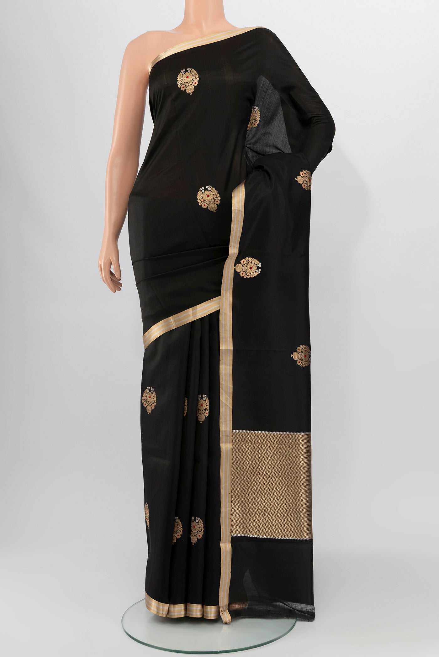Black Banarasi Silk Saree with Zari Butta on the body and Zari Border.  displayed on a mannequin