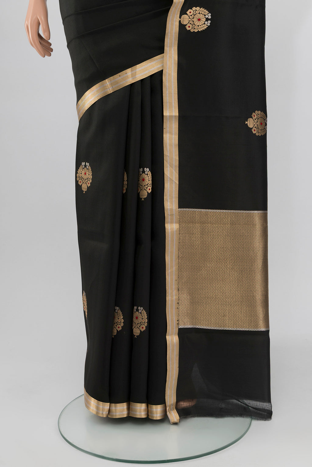 Pleats and pallu of Black Banarasi Silk Saree with Zari Butta on the body and Zari Border. 