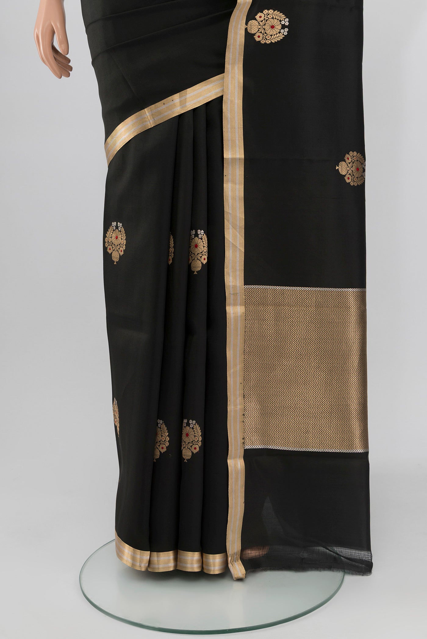 Pleats and pallu of Black Banarasi Silk Saree with Zari Butta on the body and Zari Border. 