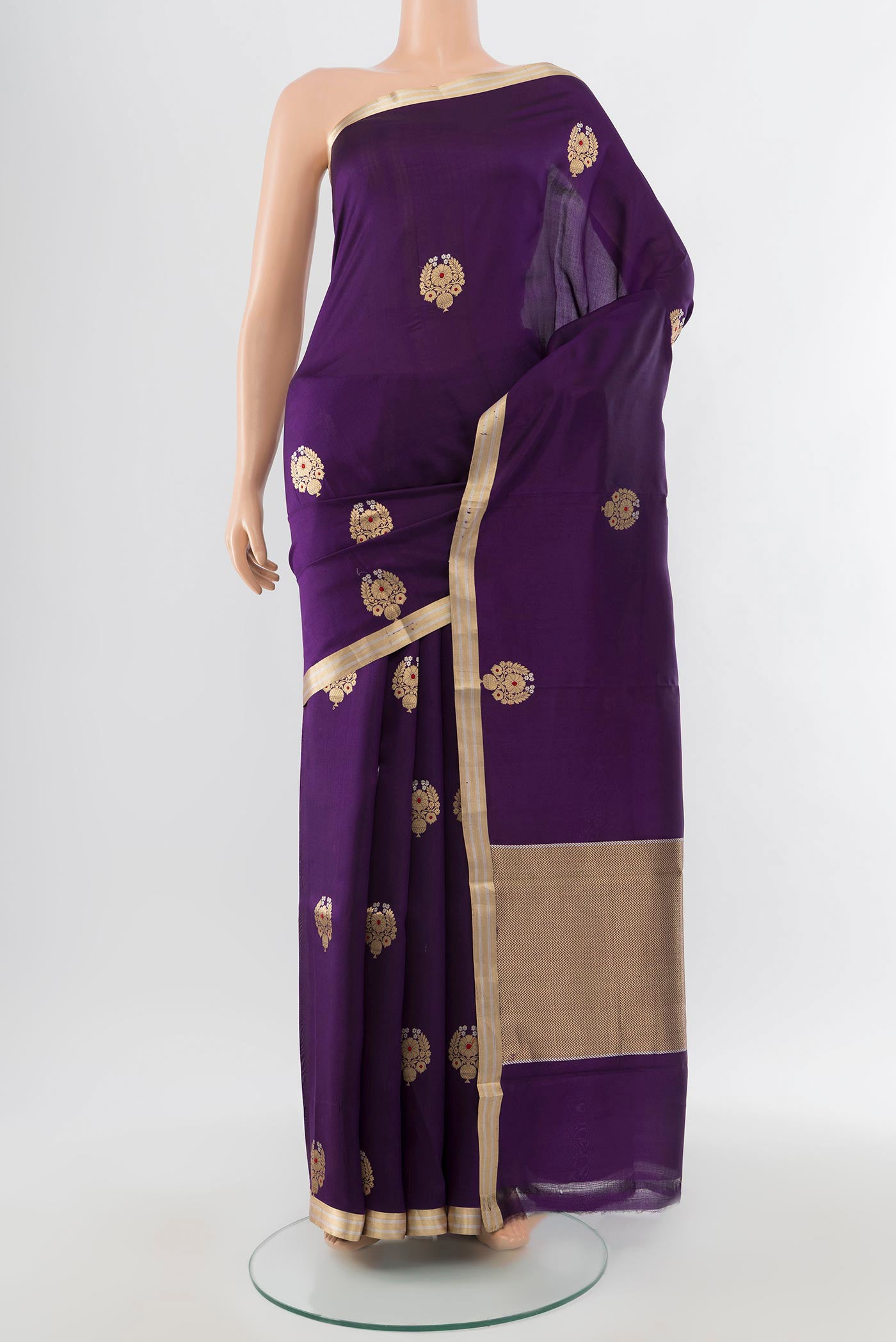 Violet Banarasi Katan Silk Saree with Zari Butta on the body and Silk Border.  displayed on a mannequin
