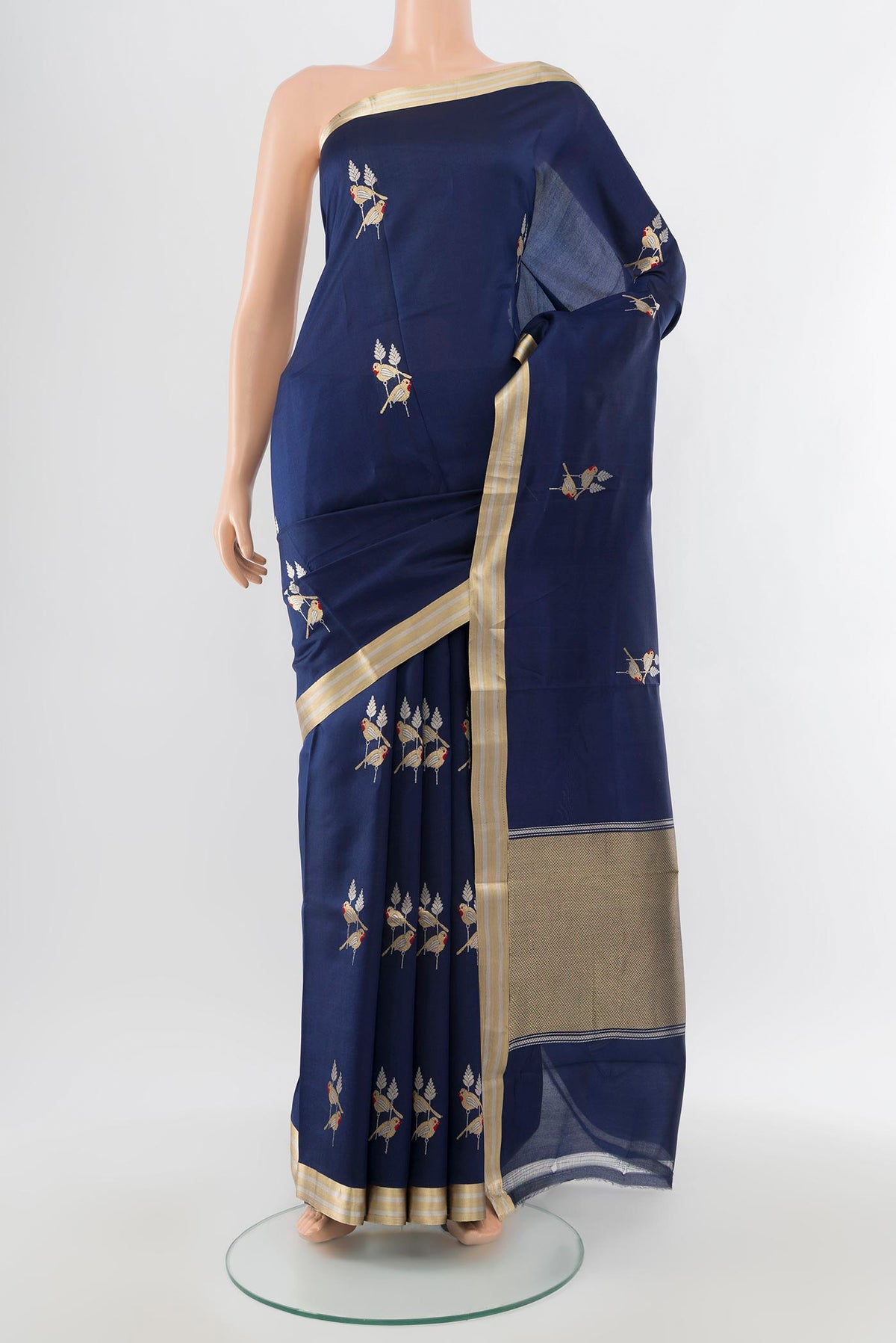 Navy Blue Banarasi Katan Silk Saree with Zari Butta on the body and Silk Border.  displayed on a mannequin