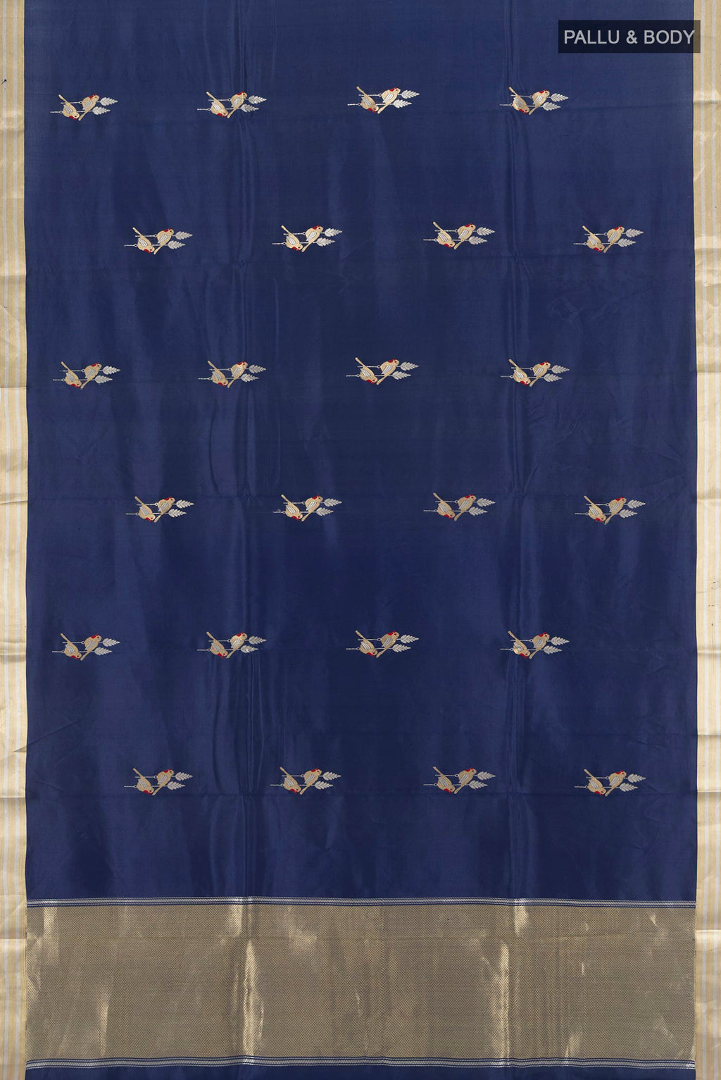 Flat view of Navy Blue Banarasi Katan Silk Saree with Zari Butta on the body and Silk Border. 