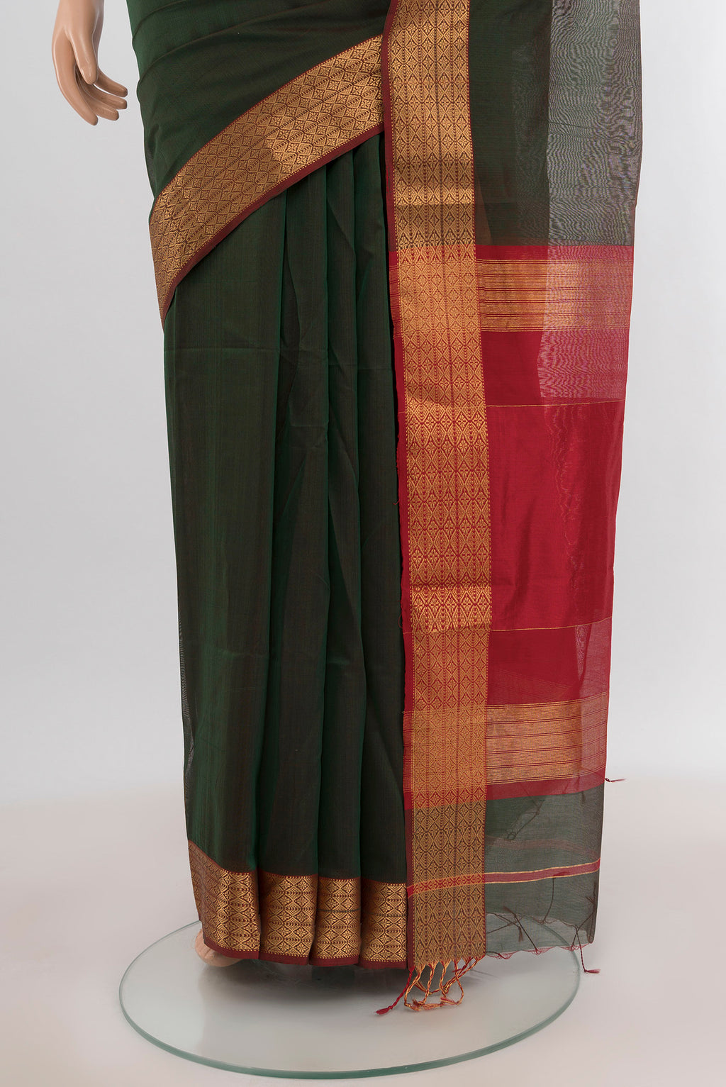 Pleats and pallu of Bottle Green Maheshwari Silk Cotton Saree with Plain Body and Zari Border. 
