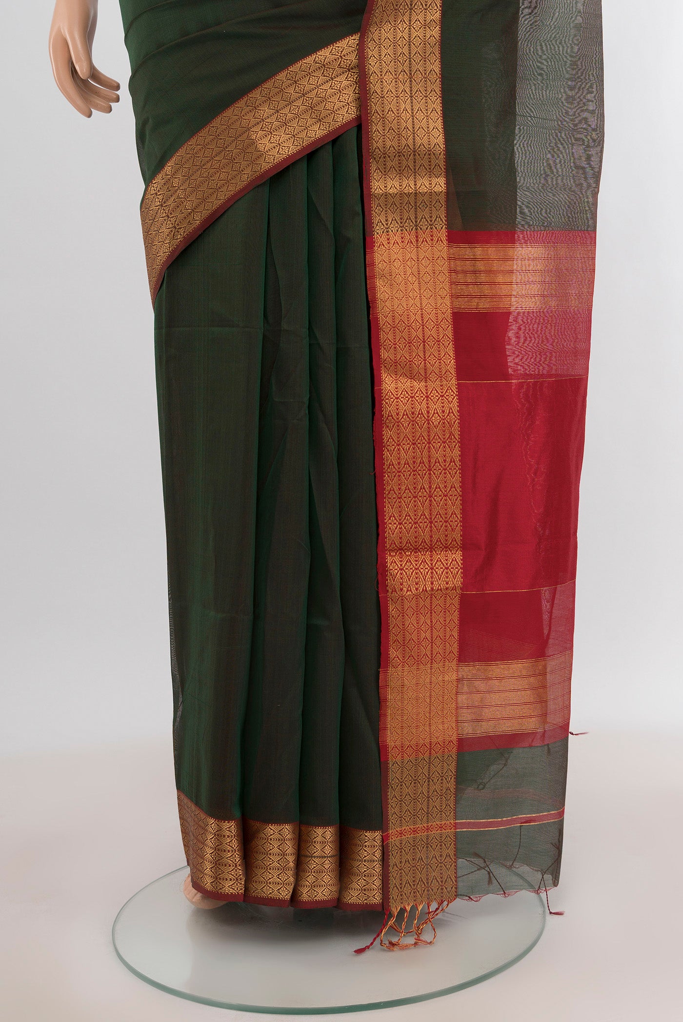 Pleats and pallu of Bottle Green Maheshwari Silk Cotton Saree with Plain Body and Zari Border. 