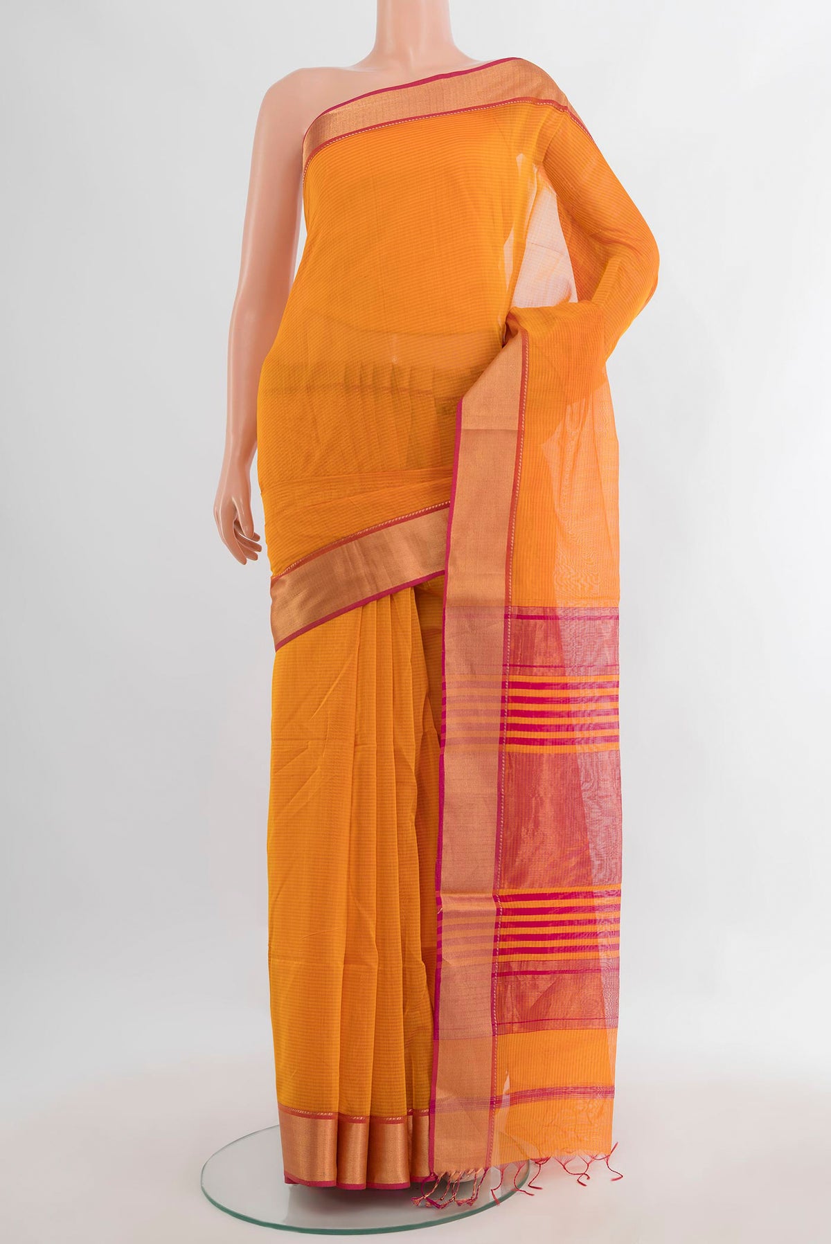 Orange Maheshwari Cotton Saree with Plain Body and Zari Border.  displayed on a mannequin