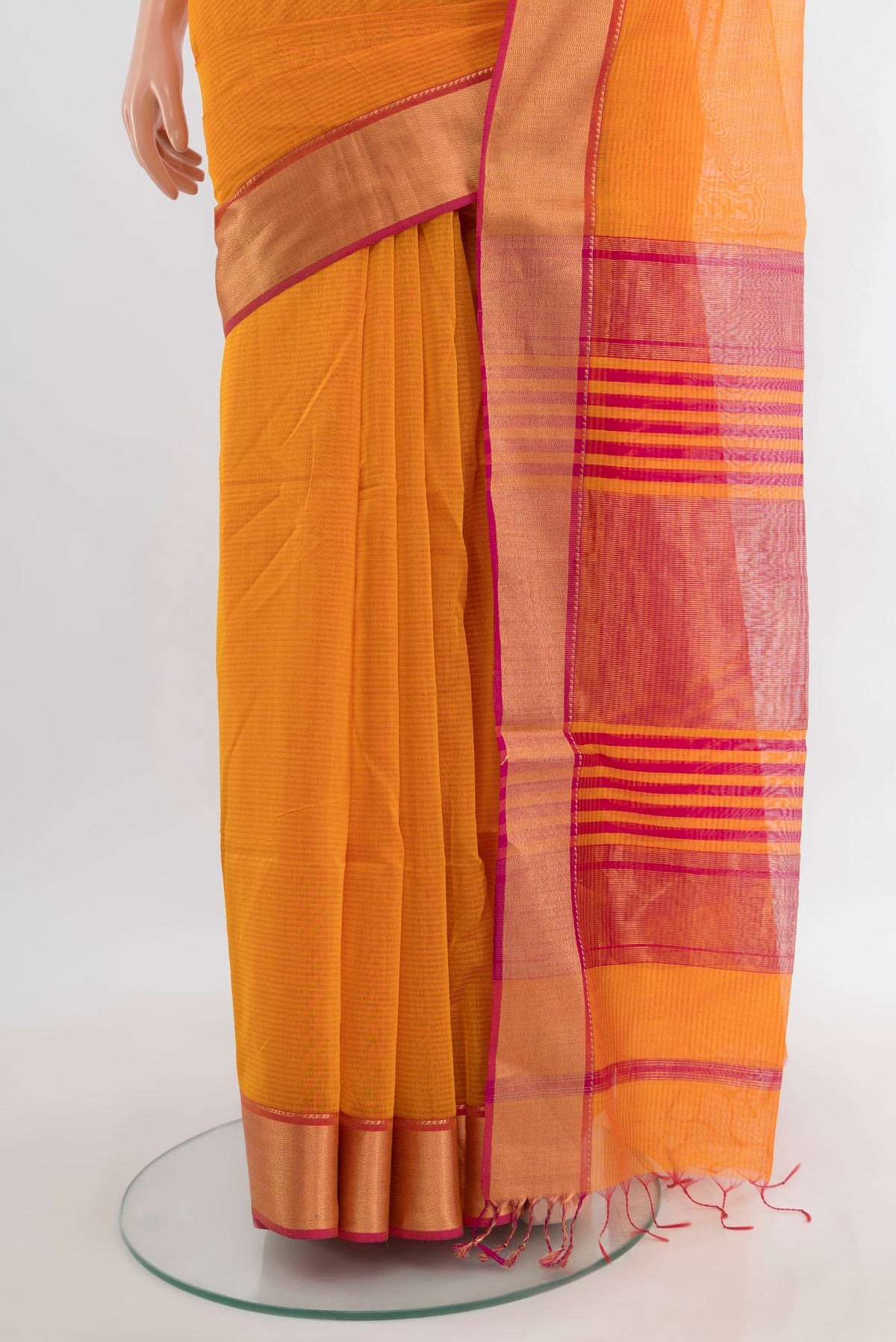 Pleats and pallu of Orange Maheshwari Cotton Saree with Plain Body and Zari Border. 