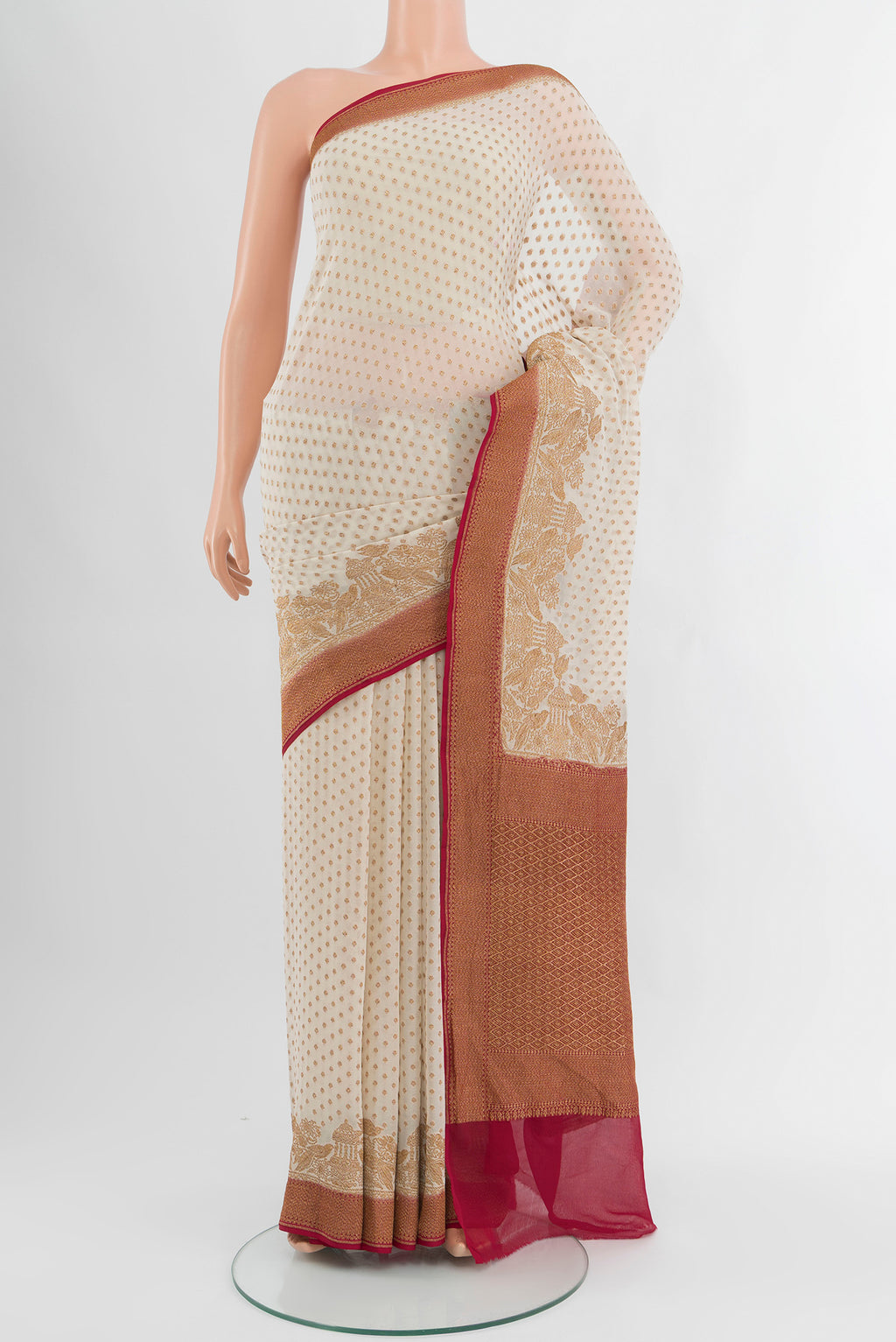Off White Banarasi Georgette Saree with Zari Butta on the body and Zari Border.  displayed on a mannequin