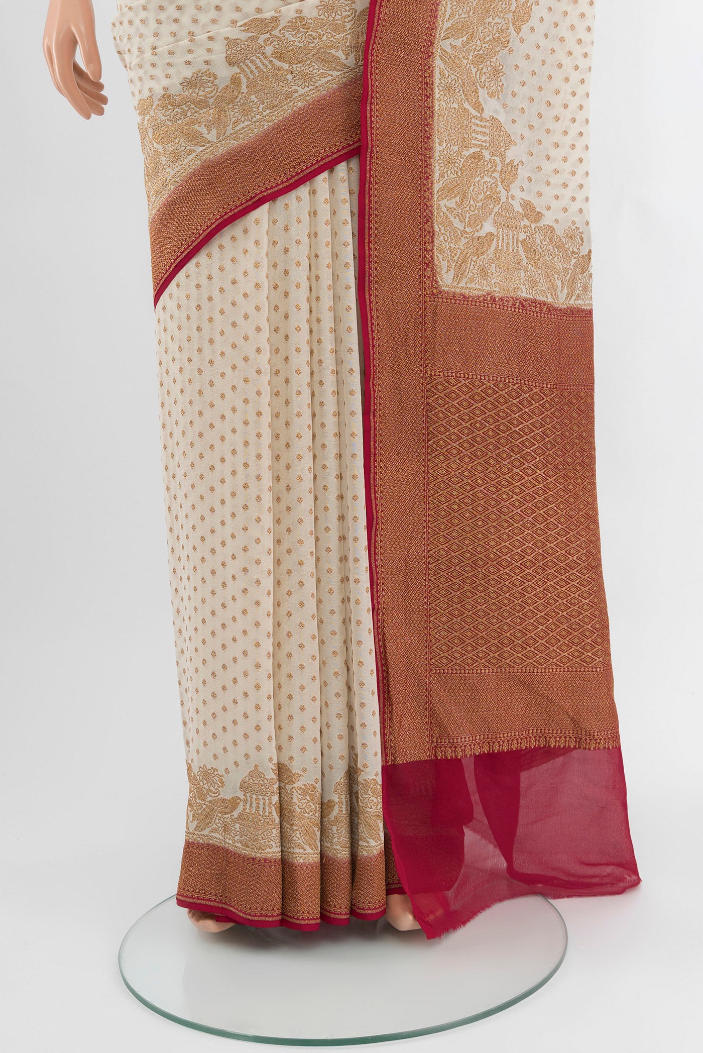 Pleats and pallu of Off White Banarasi Georgette Saree with Zari Butta on the body and Zari Border. 