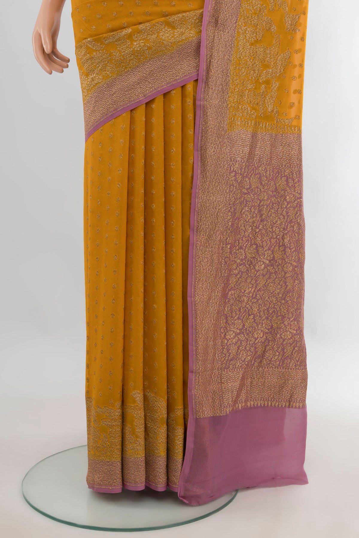 Pleats and pallu of Yellow Banarasi Georgette Saree with Zari Butta on the body and Zari Border. 