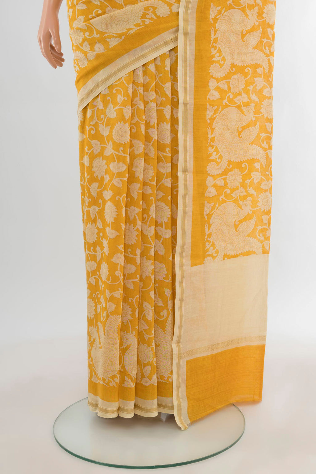 Pleats and pallu of Yellow Maheshwari Silk Cotton Saree with Floral Print on the body and Zari Border. 