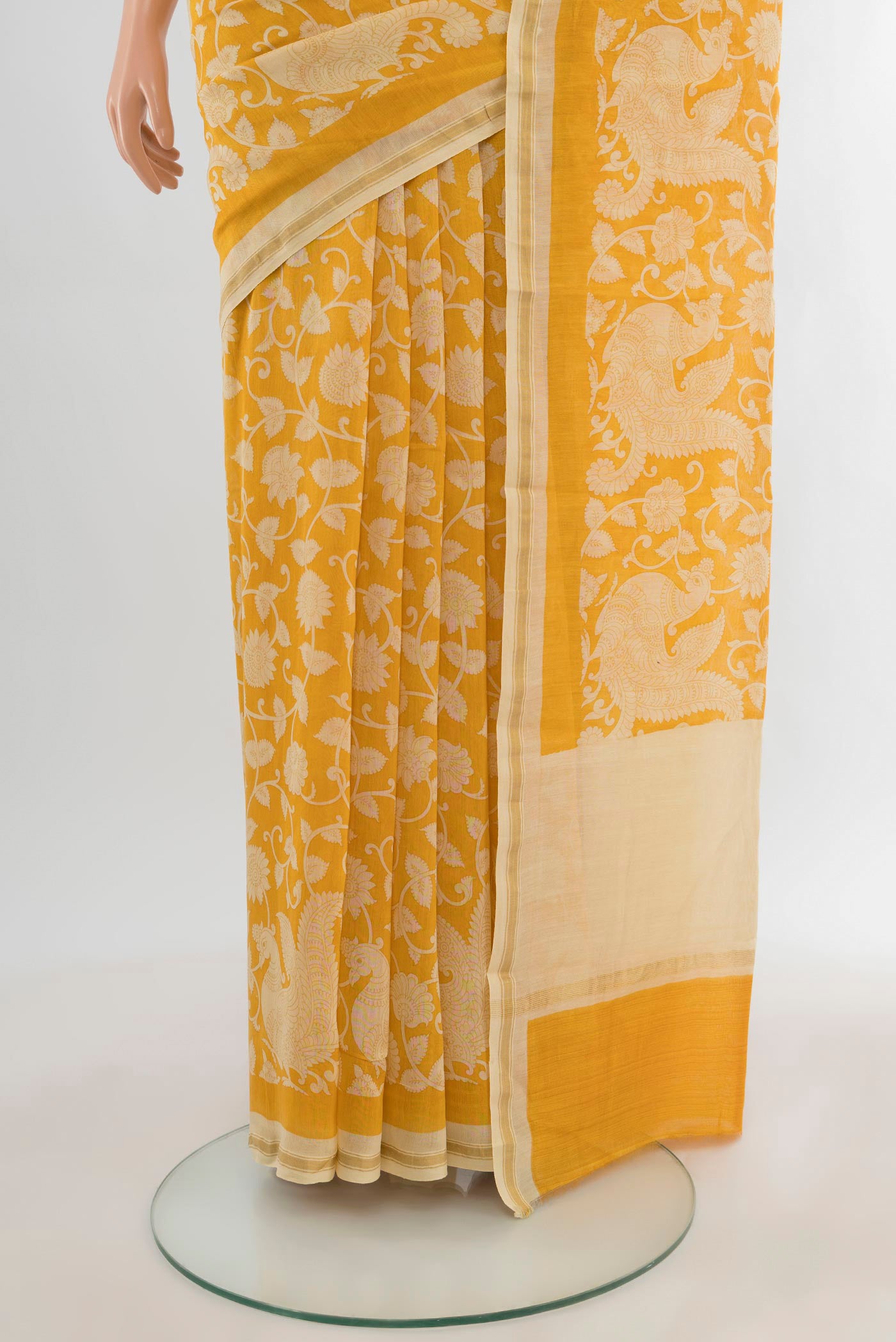 Pleats and pallu of Yellow Maheshwari Silk Cotton Saree with Floral Print on the body and Zari Border. 