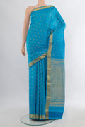 Pure Silk Light Blue Kanchipuram Saree with Zari Butta on the body and Zari Border.  displayed on a mannequin
