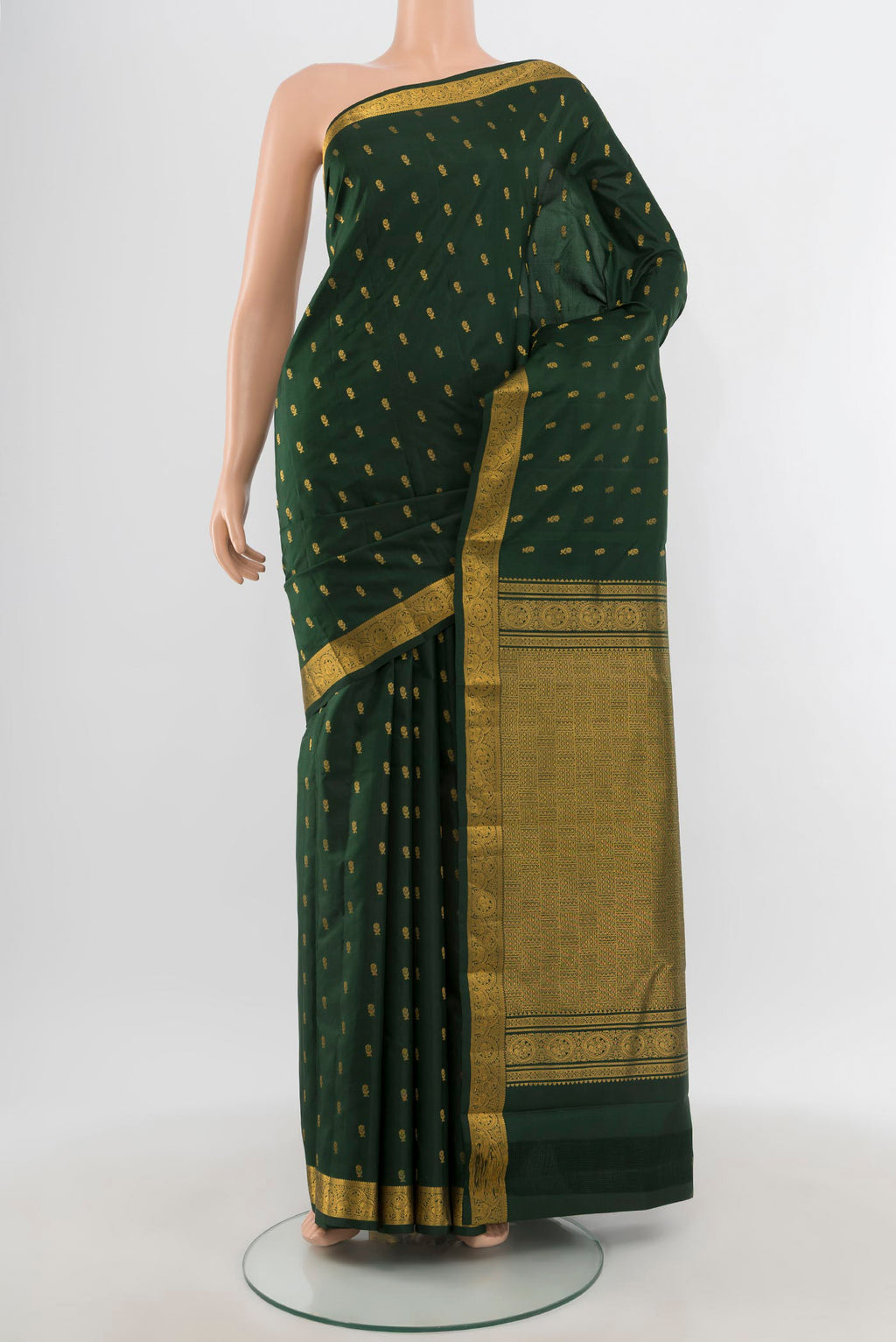 Bottle Green Kanchipuram Silk Saree with Zari Butta on the body and Zari Border.  displayed on a mannequin