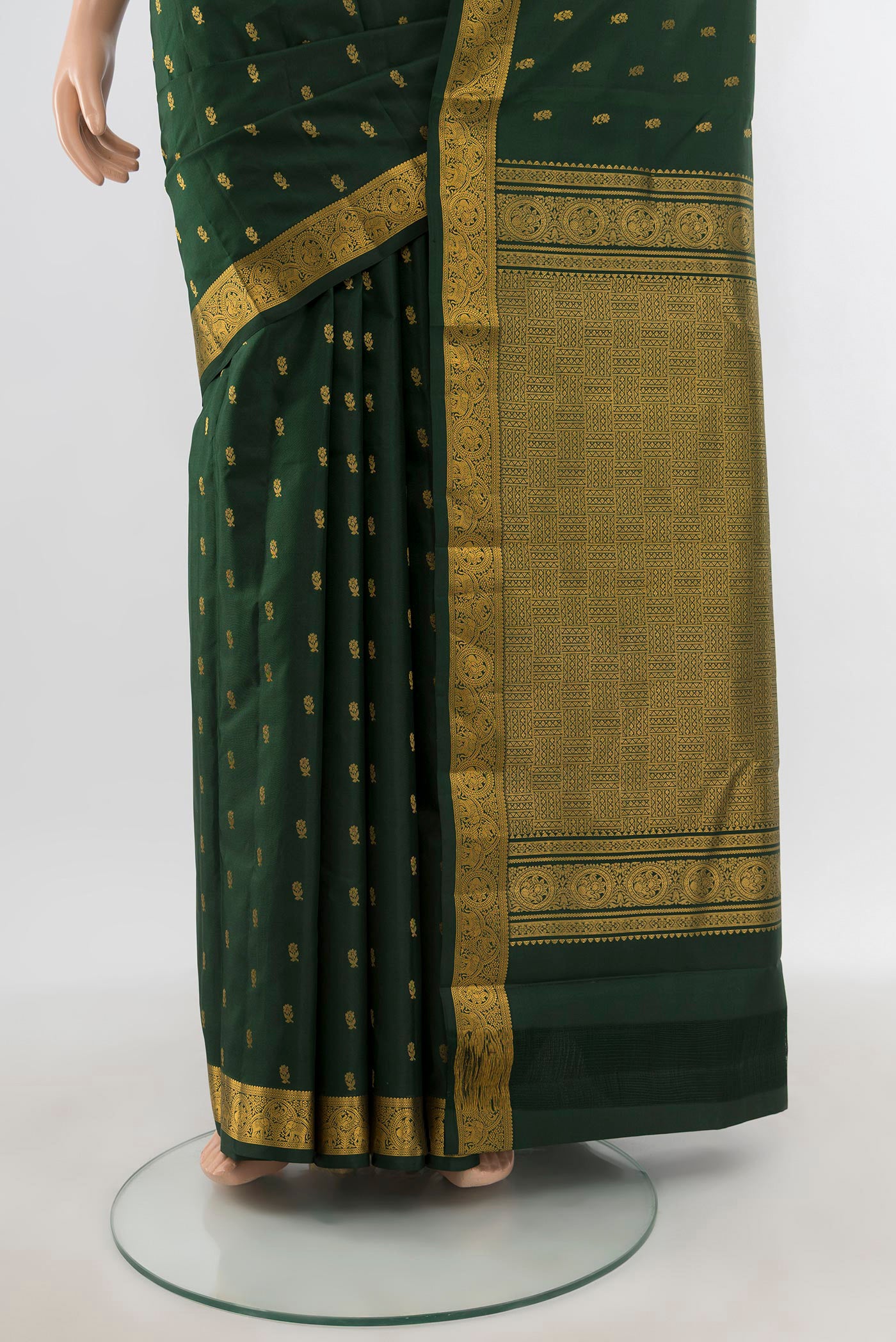Pleats and pallu of Bottle Green Kanchipuram Silk Saree with Zari Butta on the body and Zari Border. 