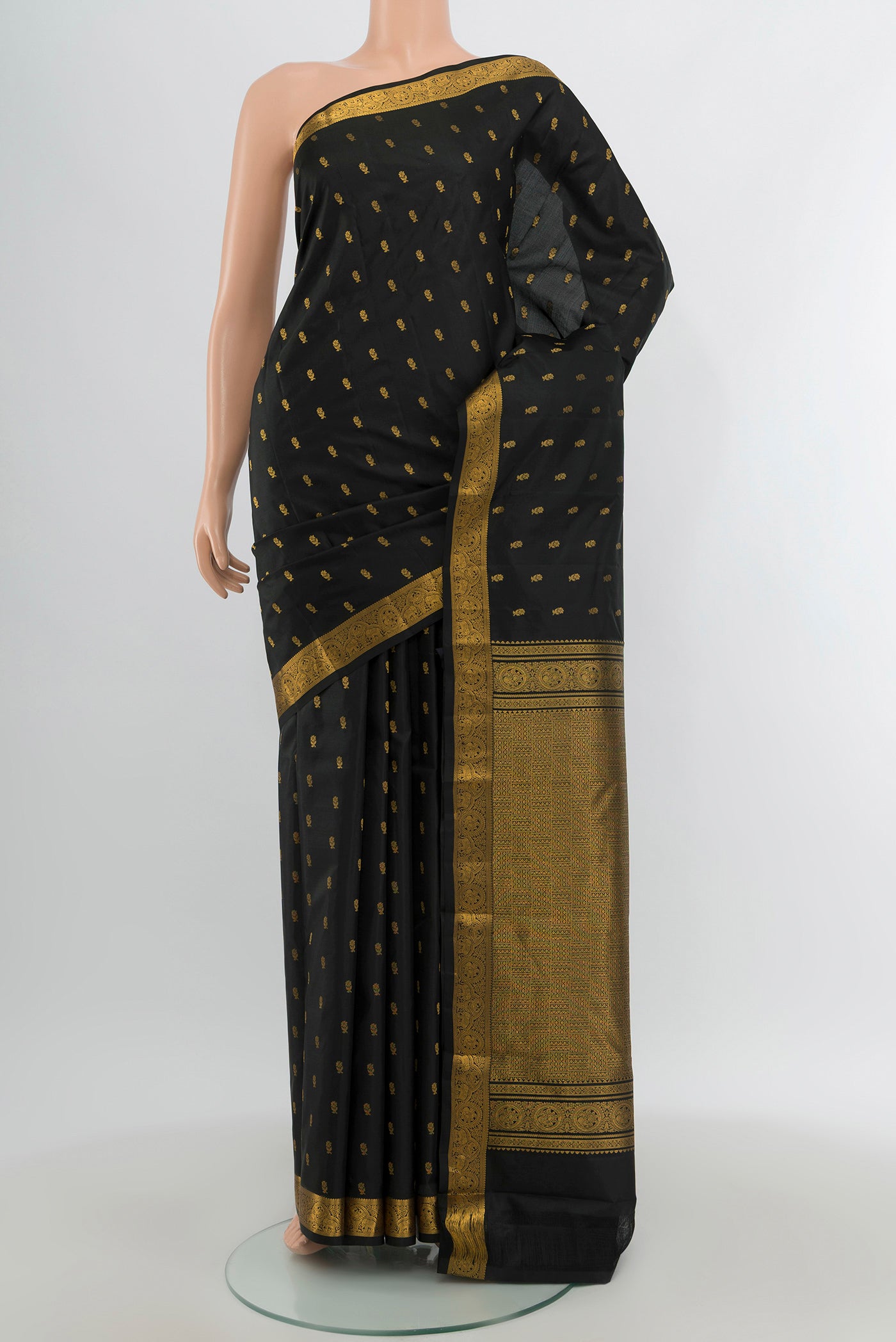 Black Kanchipuram Silk Saree with Zari Butta on the body and Zari Border.  displayed on a mannequin