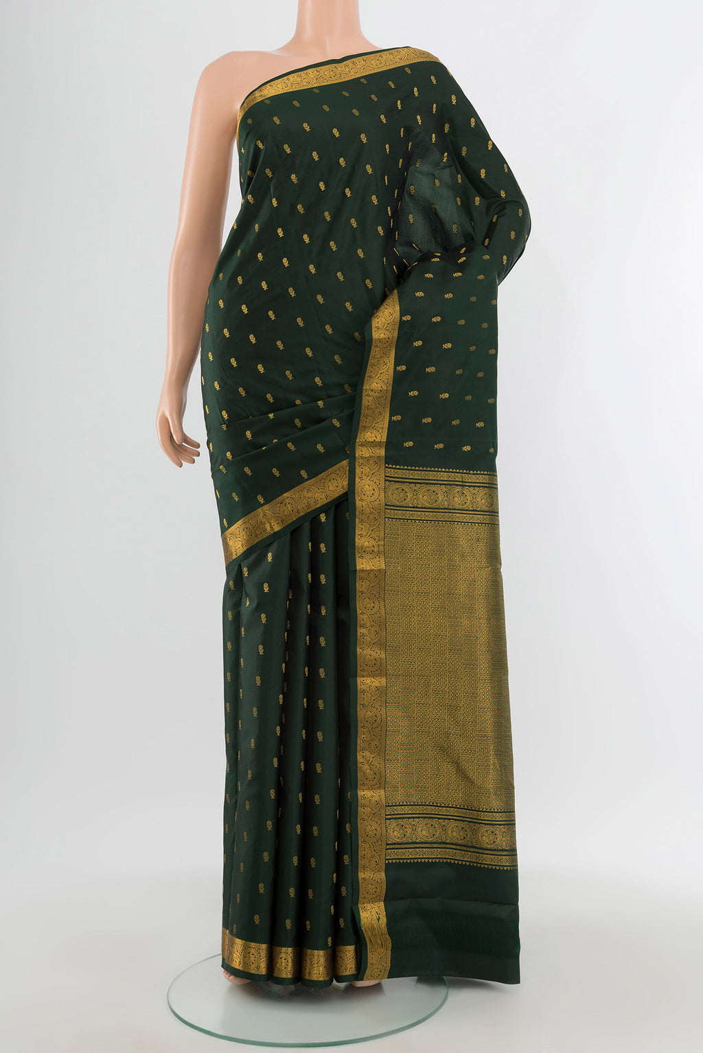 Bottle Green Kanchipuram Silk Saree with Zari Butta on the body and Zari Border.  displayed on a mannequin