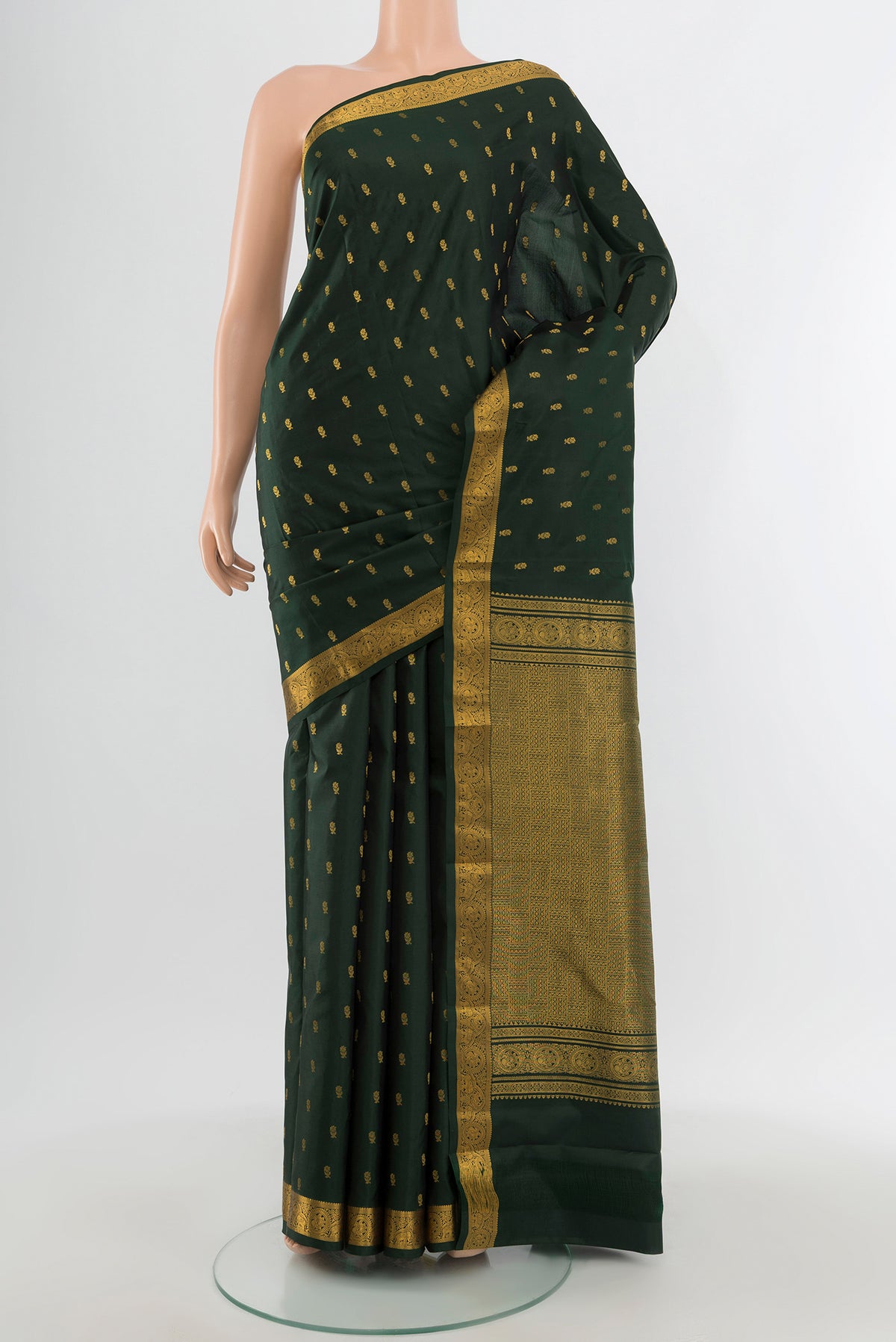 Bottle Green Kanchipuram Silk Saree with Zari Butta on the body and Zari Border.  displayed on a mannequin