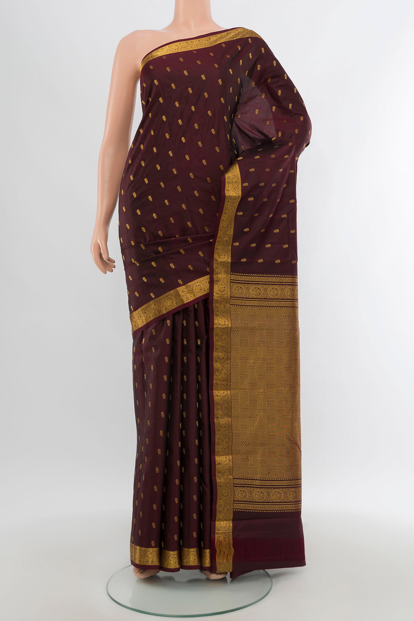 Coffee Brown Kanchipuram Silk Saree with Zari Butta on the body and Zari Border.  displayed on a mannequin
