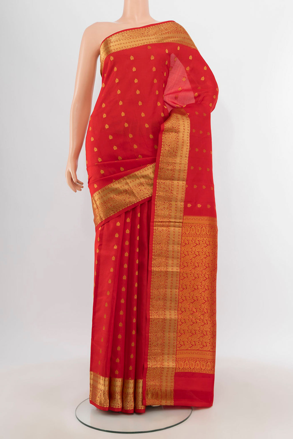 Red Kanchipuram Silk Saree with Zari Butta on the body and Zari Border.  displayed on a mannequin