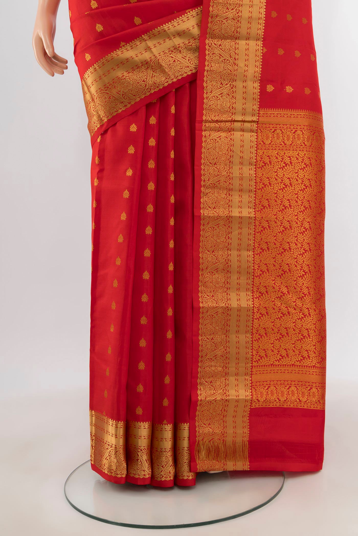 Pleats and pallu of Red Kanchipuram Silk Saree with Zari Butta on the body and Zari Border. 