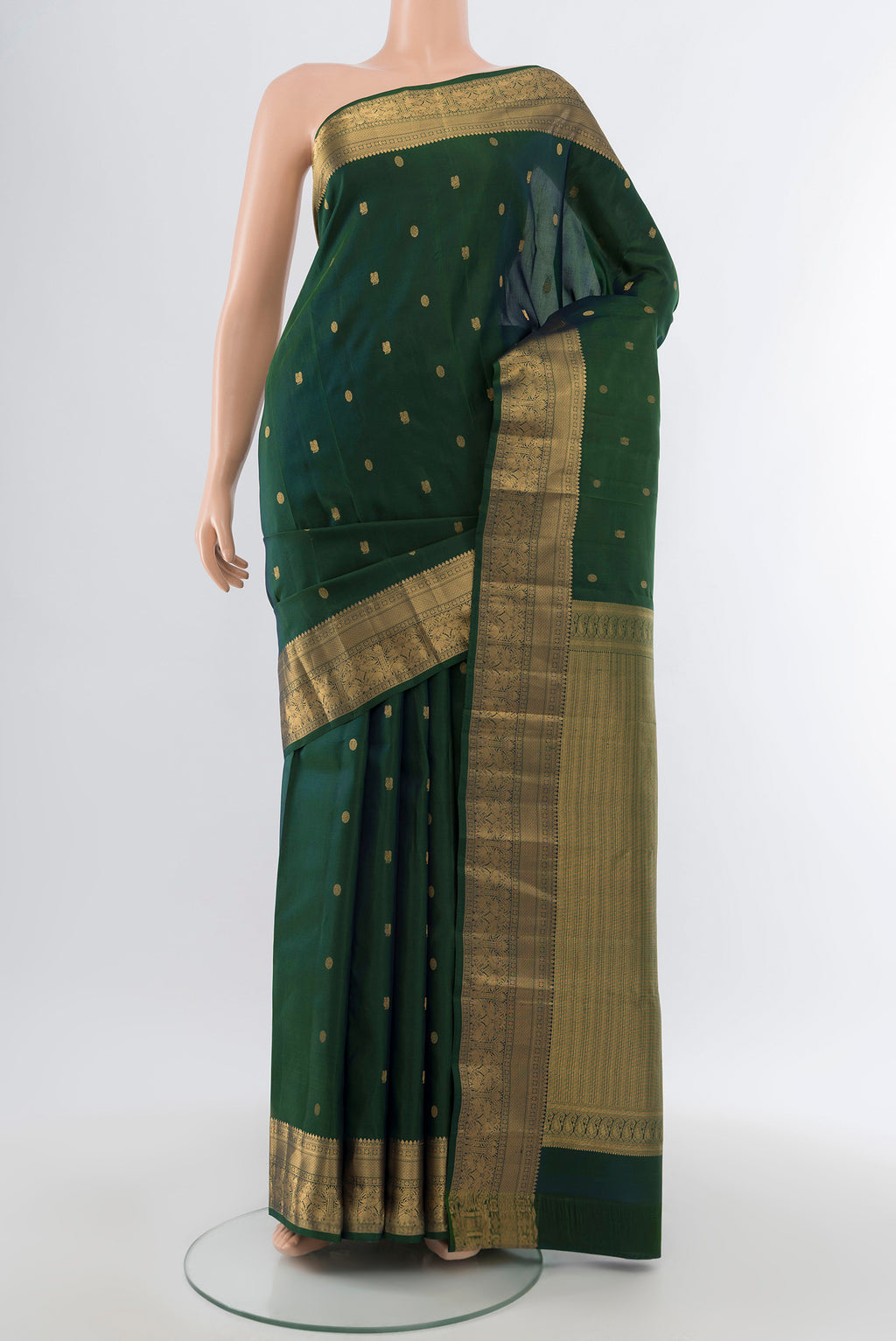Pure Silk Pure Zari Bottle Green Kanchipuram Saree with Zari Butta on the body and Silk Border.  displayed on a mannequin